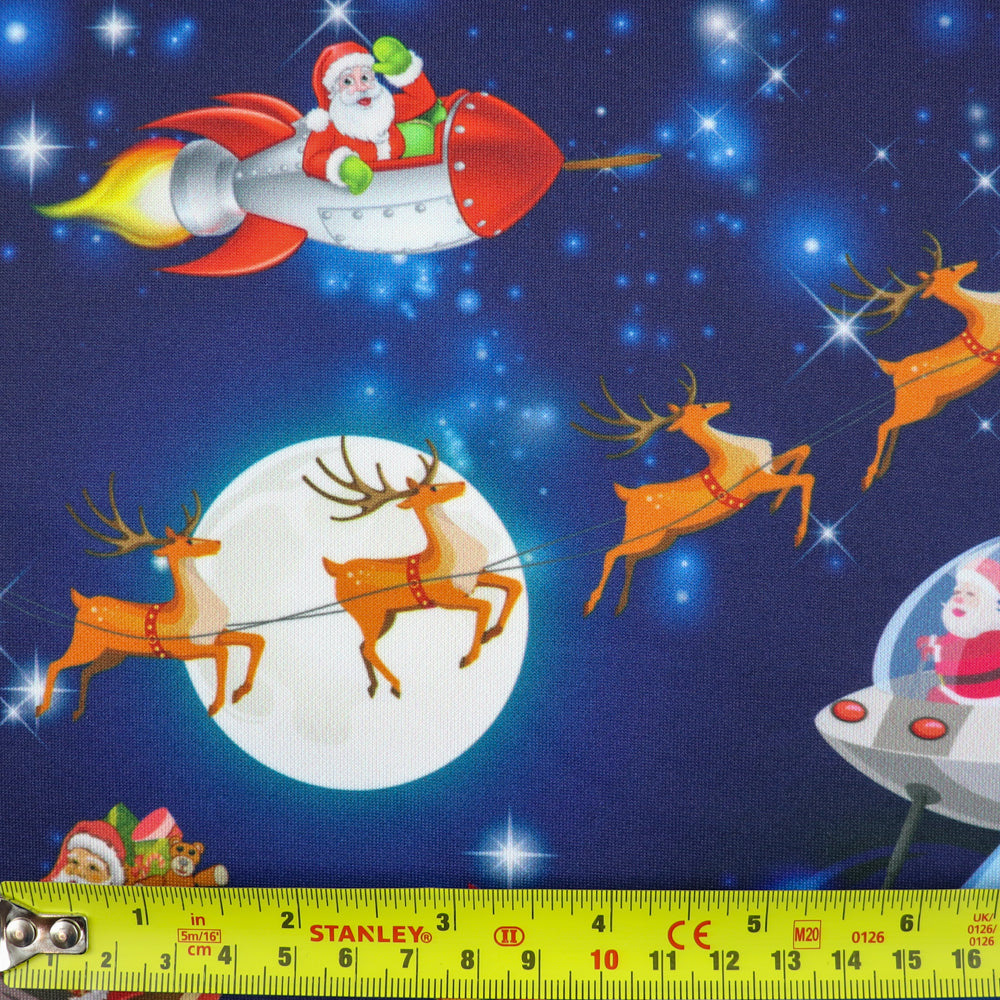 FS1073 Santas Deliveries Scuba Stretch Knit Fabric Blue | Fabric | blue, Christmas, Christmas scuba, drape, Fabric, fashion fabric, making, Moon, Plane, Reindeer, Santa, Scuba, sewing, Sledge, sleigh, Stars, Stretchy, xmas | Fabric Styles