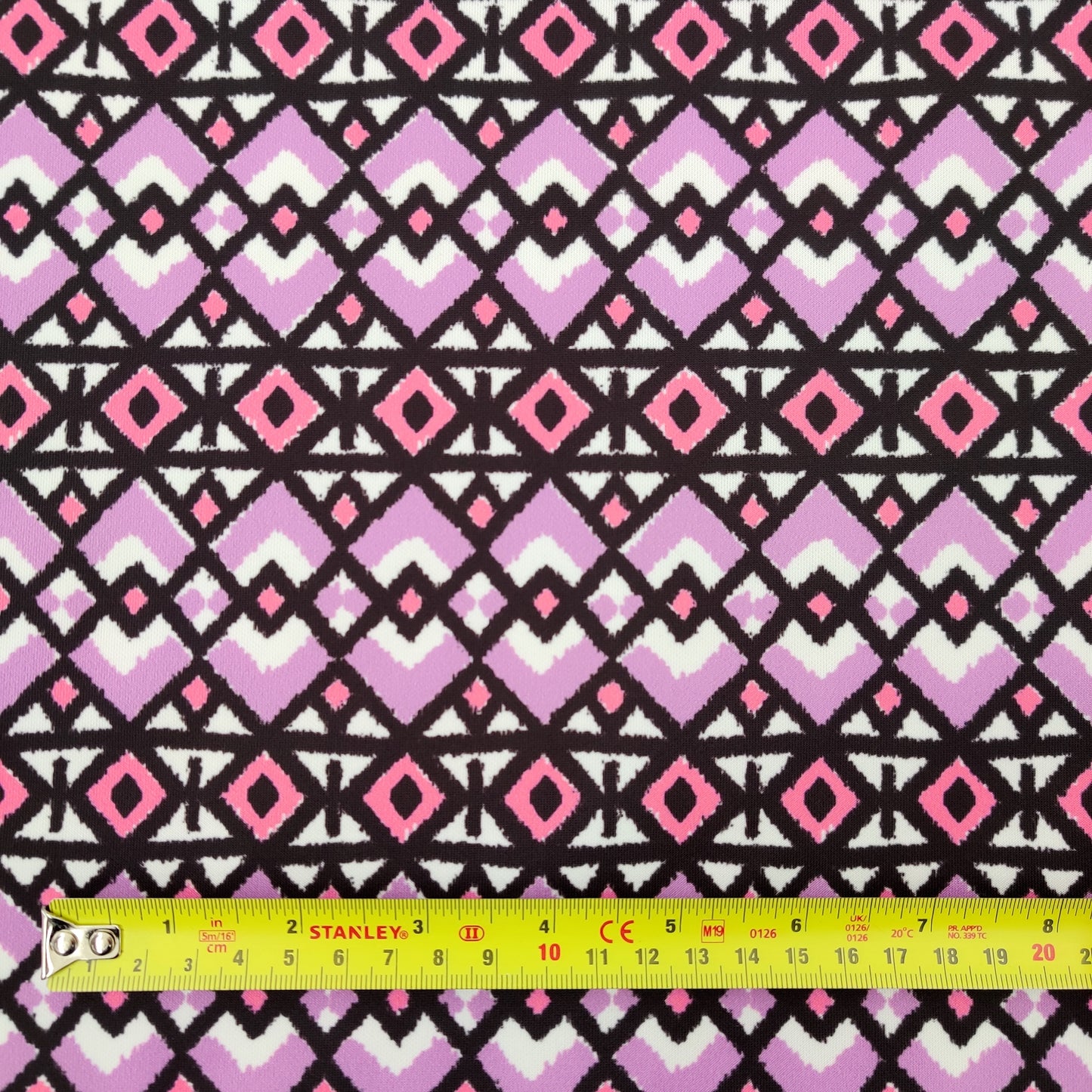 FS568 Lilac Geometric | Fabric | aztec, drape, Fabric, fashion fabric, Geometric, jersey, lilac, making, purple, repeat, sale, Scuba, sewing, Stretchy, tile | Fabric Styles