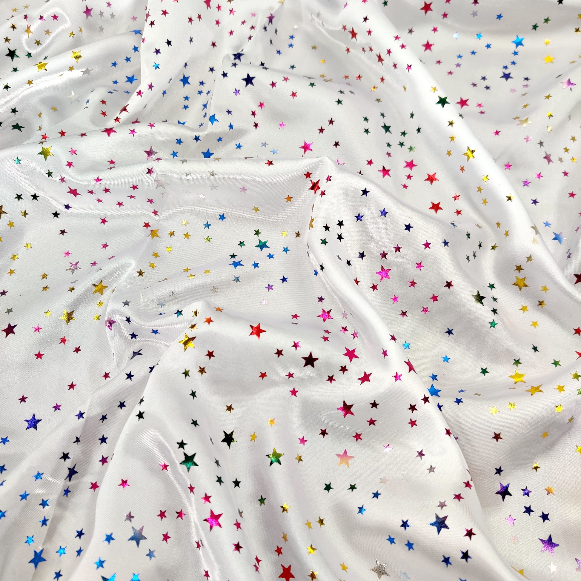 FS594 Multi Star Foil | Fabric | Animal, blue, drape, elastane, Fabric, fashion fabric, Foil, FS580, jersey, Leopard, Limited, making, Pink, Polyester, purple, Rainbow, Satin, sewing, Skirt, STar, Stars, Stretchy, Watercolour | Fabric Styles