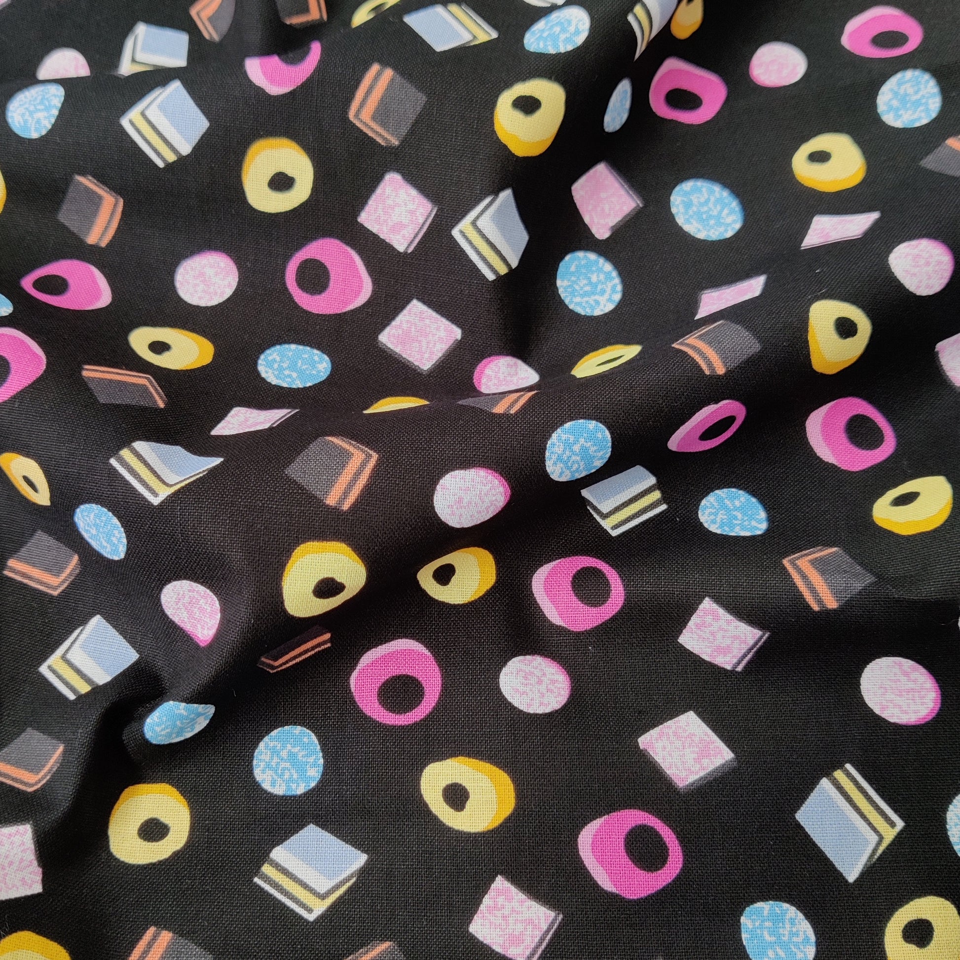 FS656 Liquorice Allsorts Sweets Cotton Fabric Black | Fabric | Black, blue, celebration, Cotton, Denim, drape, Fabric, fashion fabric, grey, licensed, Liquorice, making, sewing, Skirt, wedding, wedding theme | Fabric Styles