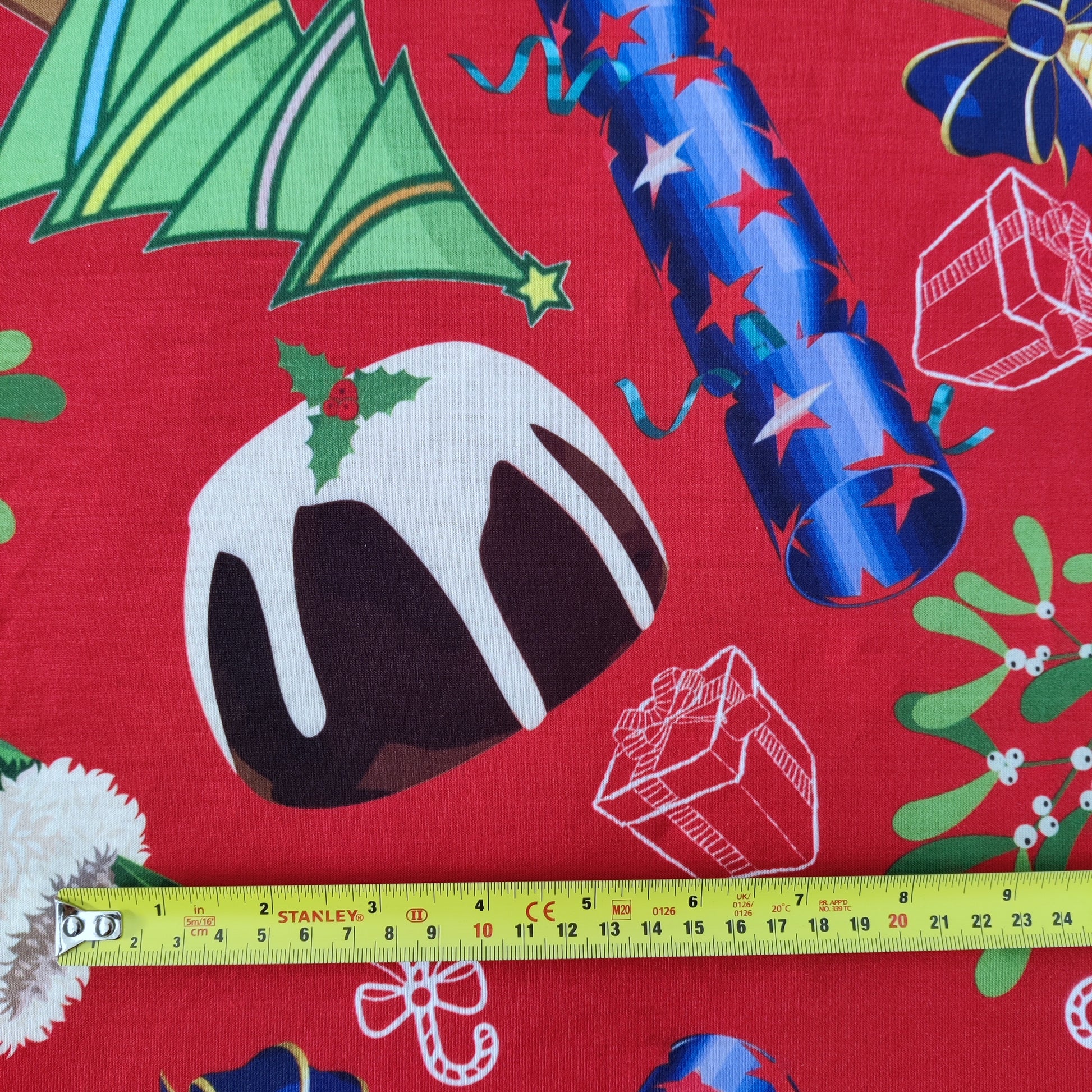 FS778 Christmas Pudding Spun Polyester Jersey Knit Stretch Fabric Red | Fabric | bauble, Baubles, Black, Candy Cane, Candy Stick, Christmas, christmas tree, Fabric, Gingerbread, Santa, Spun Polyester, Spun Polyester Elastane, Star, xmas | Fabric Styles