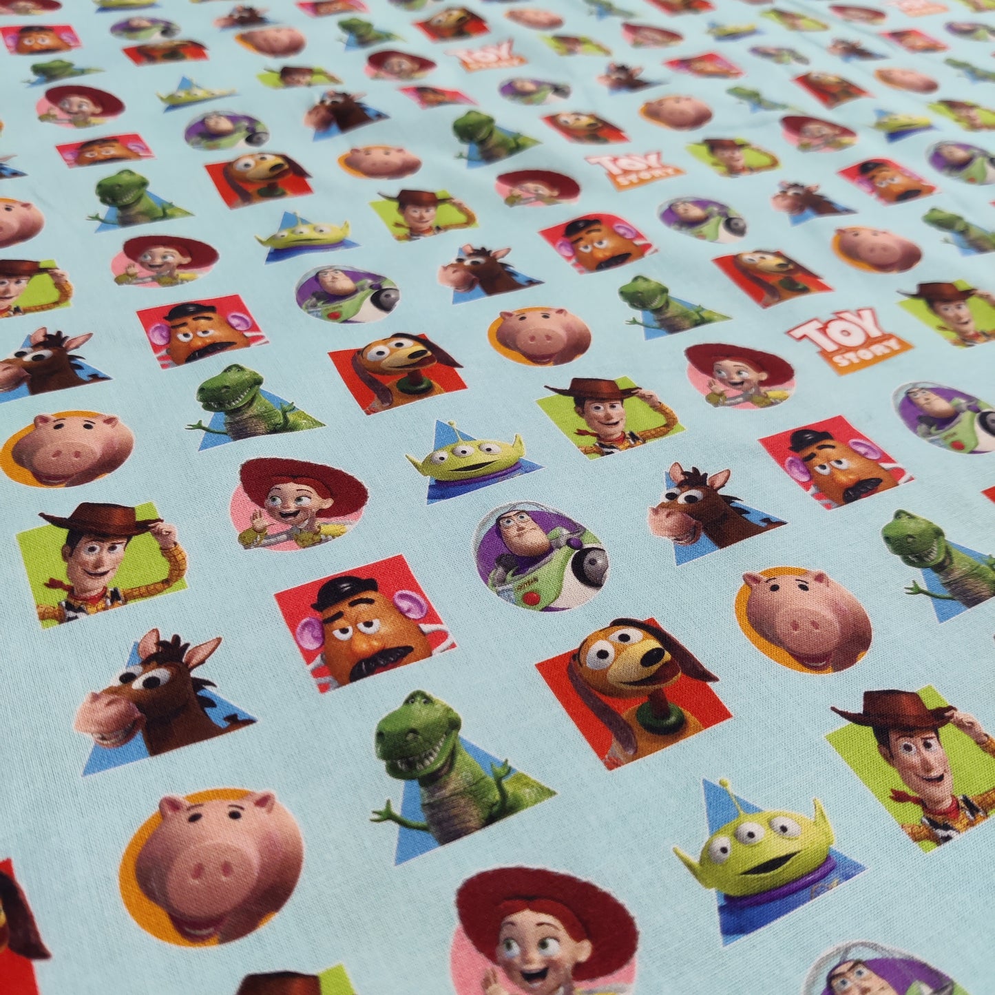 FS764_1 Toy Story Patches | Fabric | blue, Brand, Branded, Buzz, Buzz lighter, Children, Cotton, Disney, drape, Fabric, fashion fabric, Kids, Light blue, making, olaf, Pink, sewing, Skirt, Toy Story, Woody | Fabric Styles