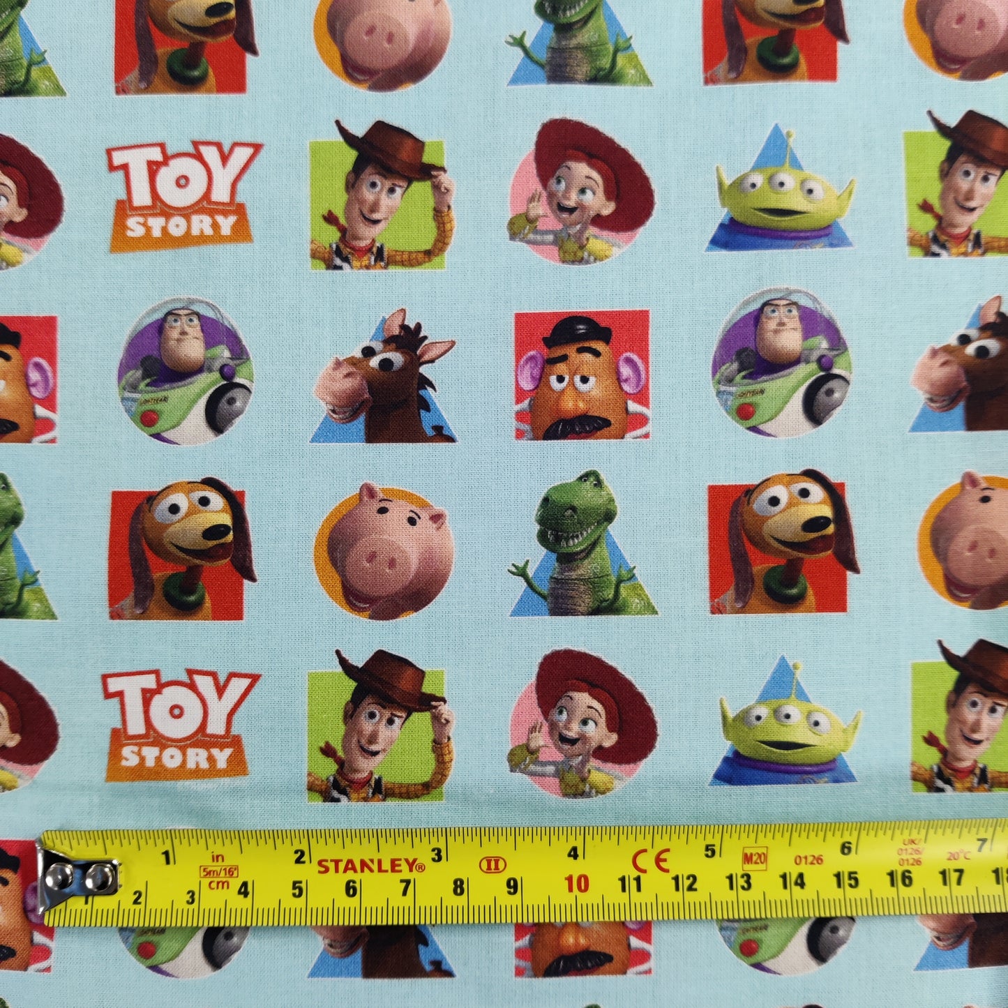 FS764_1 Toy Story Patches | Fabric | blue, Brand, Branded, Buzz, Buzz lighter, Children, Cotton, Disney, drape, Fabric, fashion fabric, Kids, Light blue, making, olaf, Pink, sewing, Skirt, Toy Story, Woody | Fabric Styles