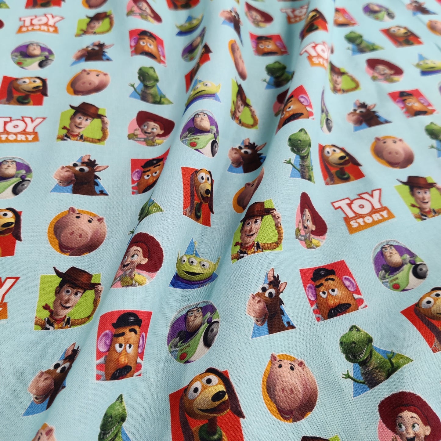 FS764_1 Toy Story Patches | Fabric | blue, Brand, Branded, Buzz, Buzz lighter, Children, Cotton, Disney, drape, Fabric, fashion fabric, Kids, Light blue, making, olaf, Pink, sewing, Skirt, Toy Story, Woody | Fabric Styles