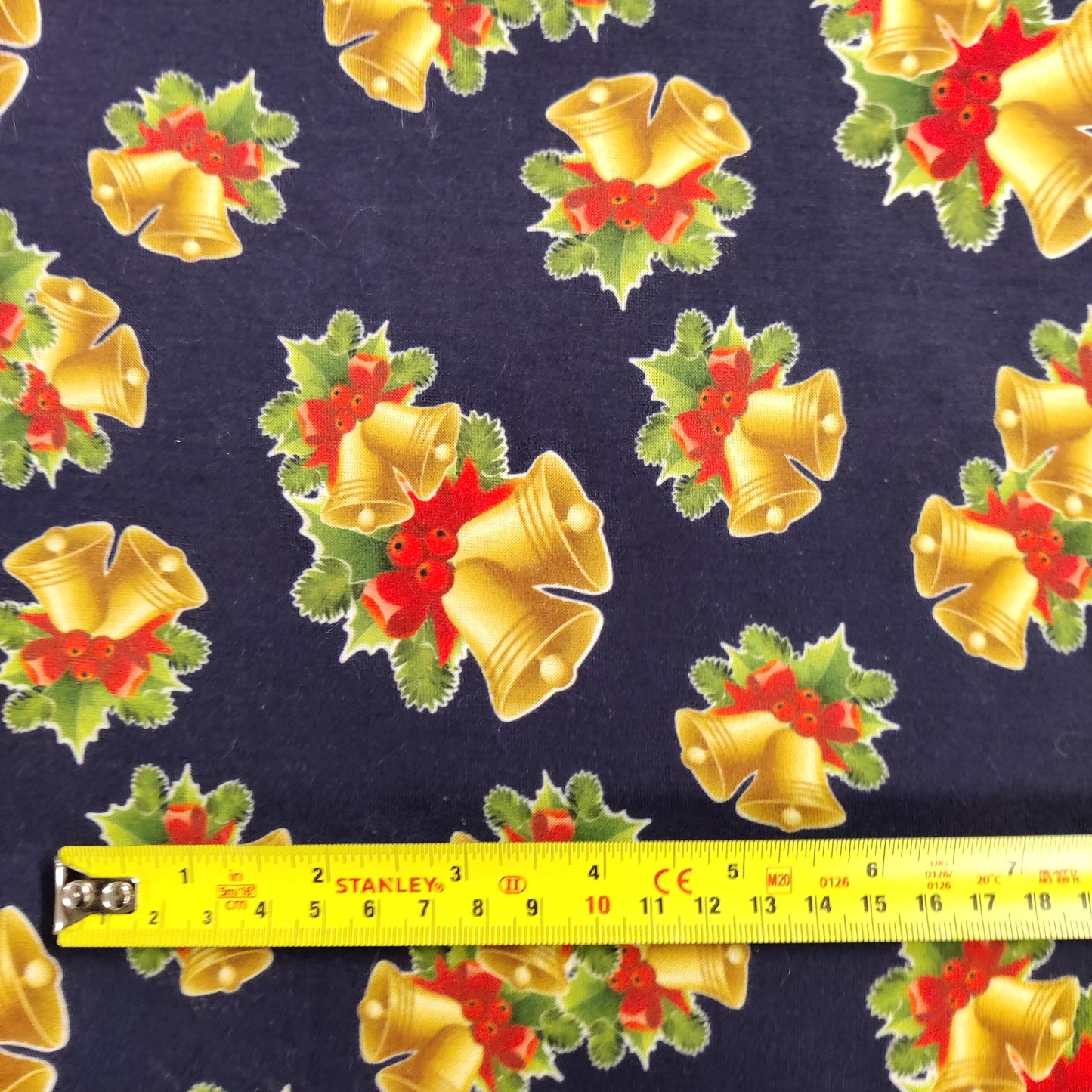 FS694 Christmas Bells Spun Polyester Jersey Knit Stretch Fabric Navy | Fabric | bauble, Baubles, Black, Candy Cane, Candy Stick, Christmas, christmas tree, Fabric, Gingerbread, Gold, Navy, sale, Santa, Spun Polyester, Spun Polyester Elastane, Star, xmas | Fabric Styles