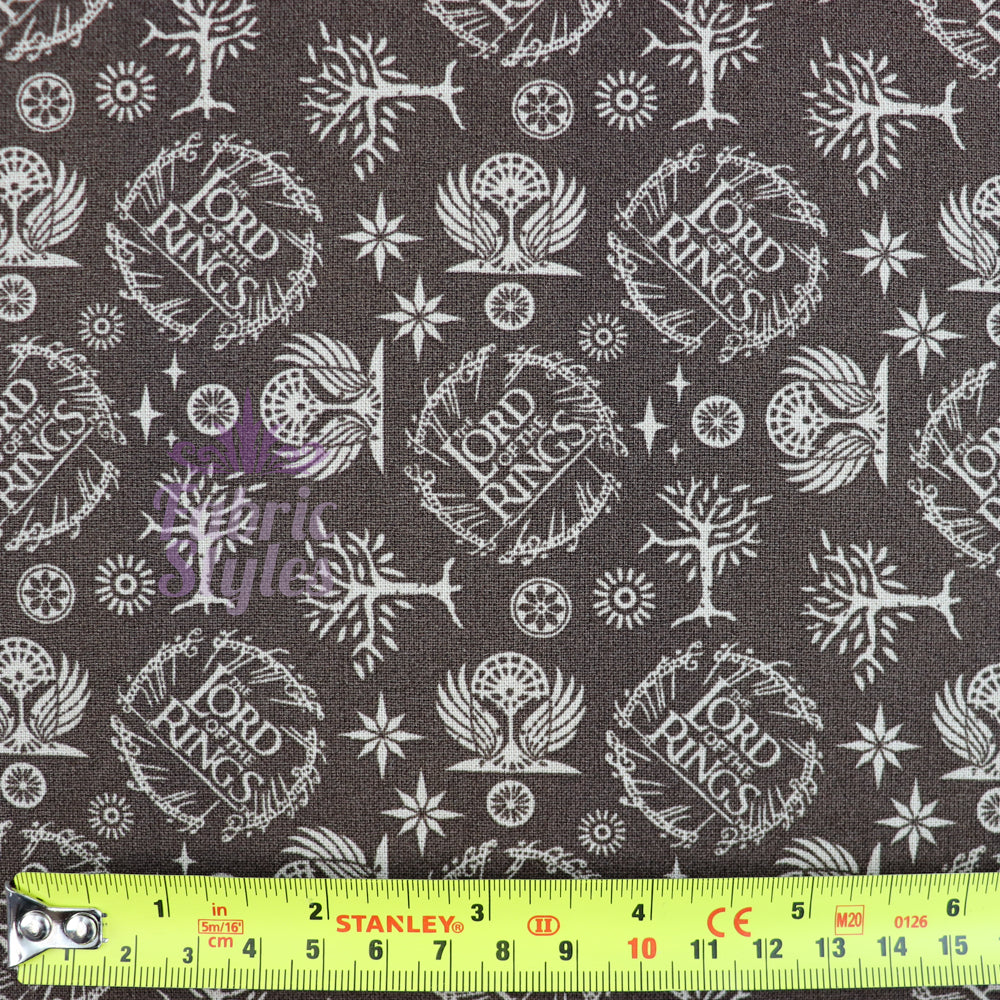 FS982_2 Lord The Of The Rings Logo in Taupe - Cotton | Fabric | Book, Brand, Branded, Characters, Children, comics, Cotton, Fabric, fashion fabric, Logo, Lord, Lord of the Rings, making, Movie, Ring, Rings | Fabric Styles