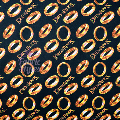 FS982_5 Lord The Of The Rings Tossed Black - Cotton | Fabric | Book, Brand, Branded, Characters, Children, comics, Cotton, Fabric, fashion fabric, Logo, Lord, Lord of the Rings, making, Movie, Ring, Rings | Fabric Styles