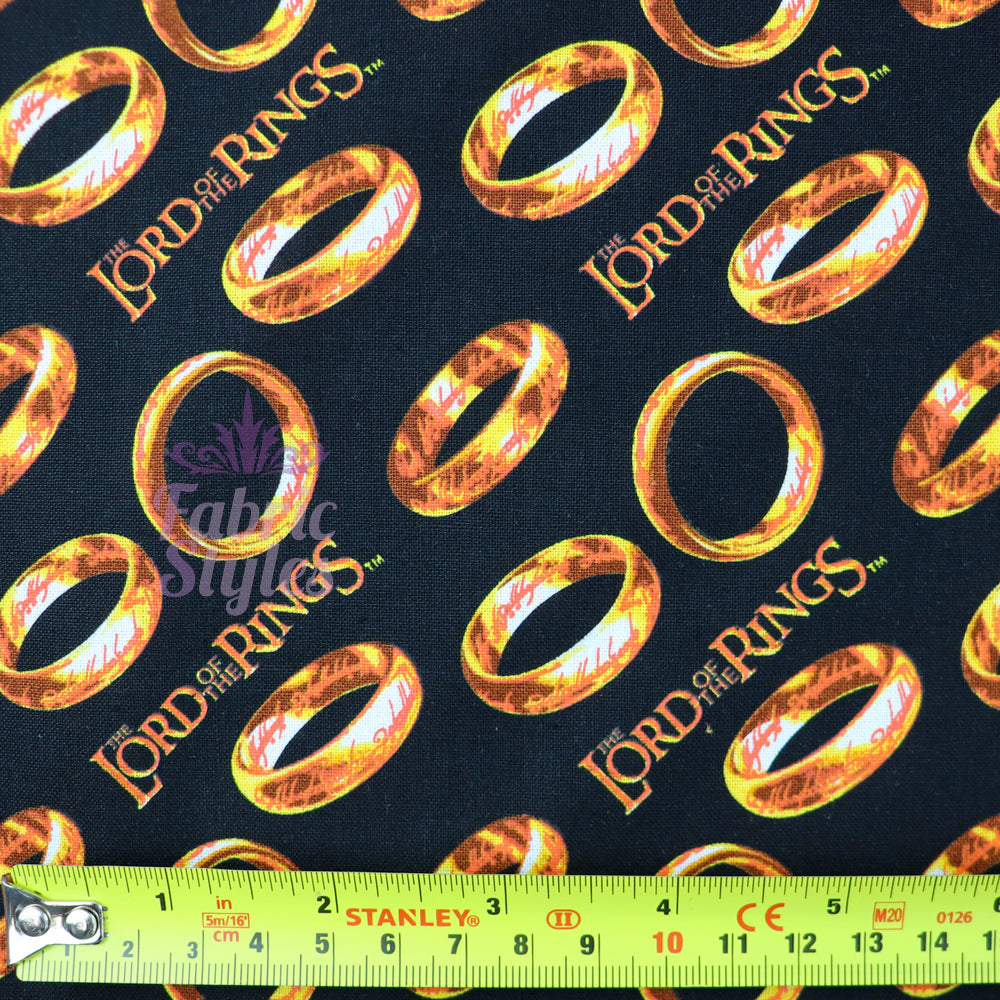 FS982_5 Lord The Of The Rings Tossed Black - Cotton | Fabric | Book, Brand, Branded, Characters, Children, comics, Cotton, Fabric, fashion fabric, Logo, Lord, Lord of the Rings, making, Movie, Ring, Rings | Fabric Styles