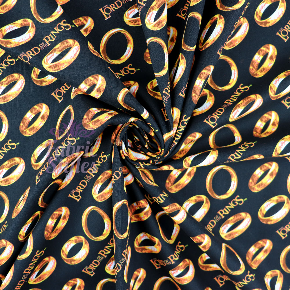 FS982_5 Lord The Of The Rings Tossed Black - Cotton | Fabric | Book, Brand, Branded, Characters, Children, comics, Cotton, Fabric, fashion fabric, Logo, Lord, Lord of the Rings, making, Movie, Ring, Rings | Fabric Styles