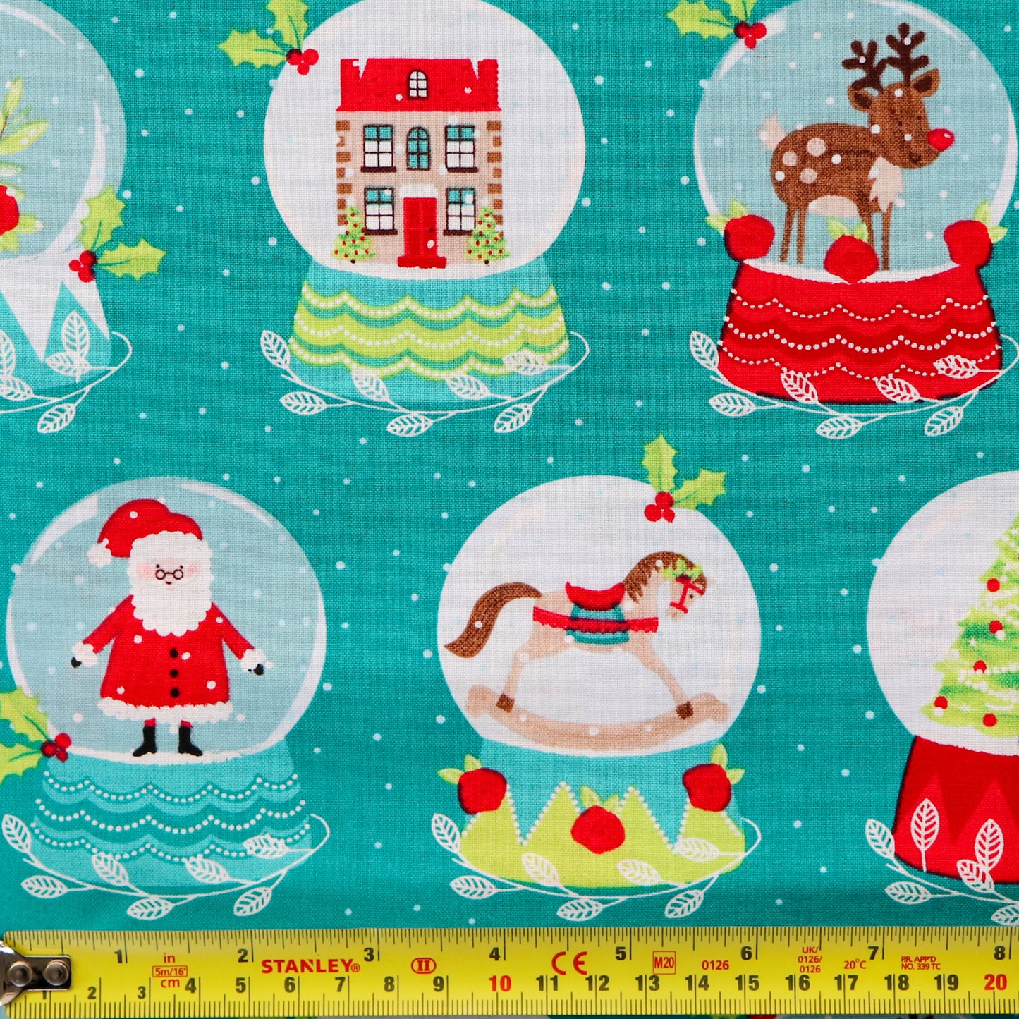 FS1162 Christmas Santa Snowglobes Cotton Fabric Green | Fabric | 100% Cotton, Christmas, Cotton, drape, Fabric, face, fashion fabric, Hat, making, Reindeer, sewing, Sledge, sleigh, Snake, Snow, Snowflake, snowflakes, Snowing, Snowman, Snowmen, Stars, xmas | Fabric Styles