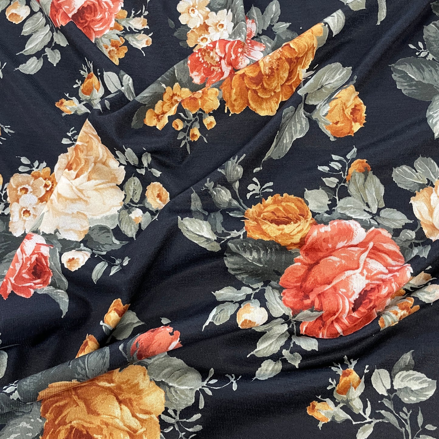 FS970 Floral Stretch Knit Fabric Black | Fabric | blue, broom, Children, drape, elastane, Fabric, fashion fabric, Floral, Flower, jersey, Kids, Knit, Knitwear, Loungewear, making, Pink, Polyester, Potions, Potter, sale, sewing, Skirt, Stretchy | Fabric Styles