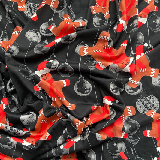 FS692 Christmas Gingerbread Spun Polyester Jersey Knit Stretch Fabric Black | Fabric | bauble, Baubles, Black, Candy Cane, Candy Stick, Christmas, christmas tree, Fabric, Gingerbread, Gold, Navy, Santa, Spun Polyester, Spun Polyester Elastane, Star, xmas | Fabric Styles